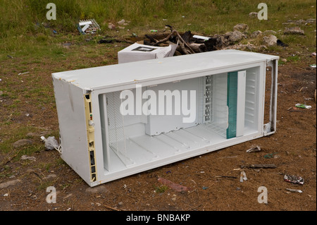 Freezer dumped on waste ground near Pontypool Torfaen South Wales UK Stock Photo