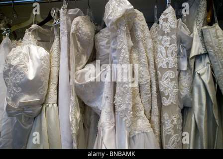 New Wedding Dresses Hanging On A Rack In Wedding Dress Shop Stock