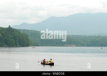 A family canoe on Waterbury Reservoir in Vermont Stock Photo