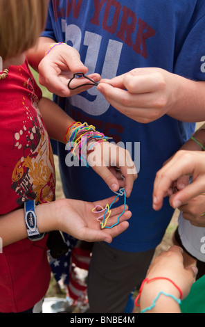 Austin, Texas USA, July 2010: Pre-teen boys trade Silly Bandz at park. ©Bob Daemmrich Stock Photo