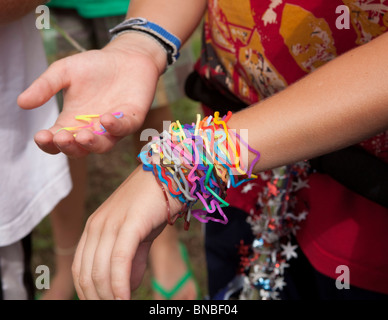 Austin, Texas USA, July 2010: Pre-teen boys trade Silly Bandz at park. ©Bob Daemmrich Stock Photo