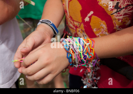 Austin, Texas USA, July 2010: Pre-teen boys trade Silly Bandz at park. ©Bob Daemmrich Stock Photo