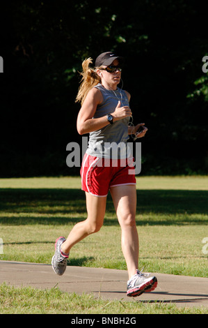 Male and female Marathon runners and joggers of all ages, shapes, sizes and ethnic diversity compete in a 5K race for recreation Stock Photo