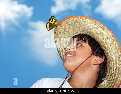 Portrait of a young beautiful boy over blue sky Stock Photo