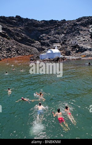 swimming in the hot springs of Palea Kameni Island, Santorini, Cyclades, Aegean Islands, Greece Stock Photo