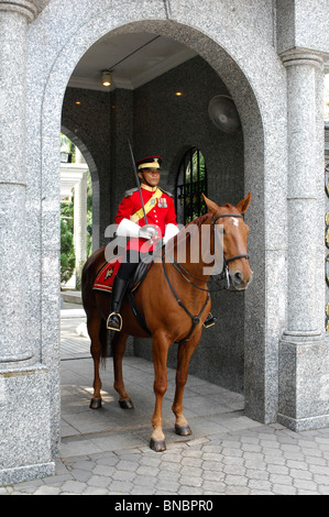 Guard on horseback at the entrance to Malaysian King's Palace, Istana Negara. Kuala Lumpur, Malaysia Stock Photo