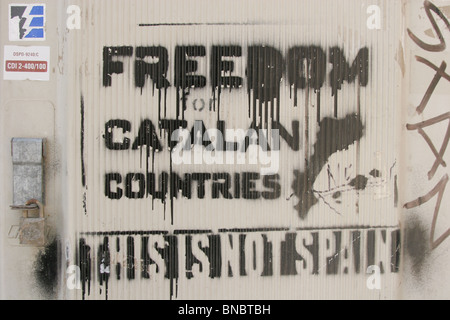 Stenciled graffiti street art declaring 'Freedom for Catalan countries, this is not Spain', Figueres, Spain. Stock Photo