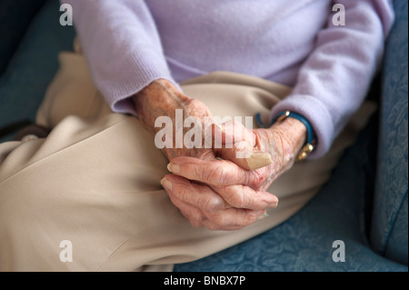 Old womans hands in lap
