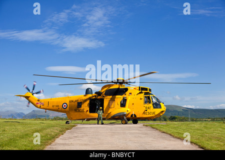 RAF Search and Rescue Sea King helicopter and crew in pre flight preparations The Lake District England UK Stock Photo