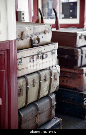 Old suitcases at railway station steam era Stock Photo