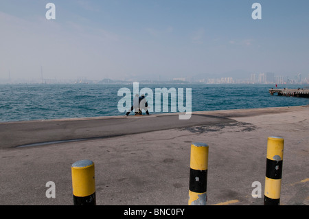 Hong Kong,At the harbour and pier at the Western District on Hong Kong Island, Kennedy Town Stock Photo