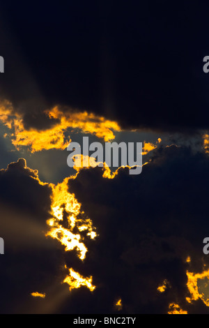 CREATIVE IMAGE OF SUN BREAKING THROUGH STORM CLOUDS WITH COPY SPACE. Stock Photo