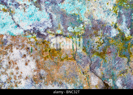 Rough dirty stone wall with color pattern Stock Photo