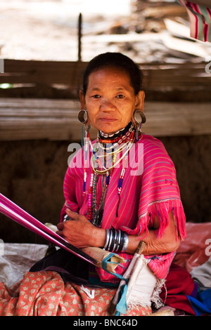 Old woman from Karen hill tribe with stretched ear lobes and wearing traditional dress, Tha Ton, Chiang Mai Province, Thailand Stock Photo