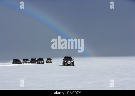 Jeep tour with rainbow on Langjokull Ice Cap, Iceland Stock Photo