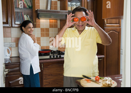 Couple enjoying in the kitchen Stock Photo