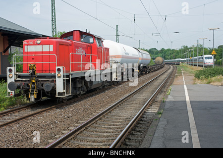 Freight train being held to allow high speed express train to pass, Leichlingen, North Rhine-Westphalia, Germany. Stock Photo