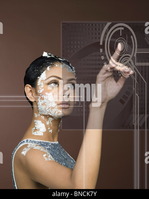 Woman using touch screen Stock Photo