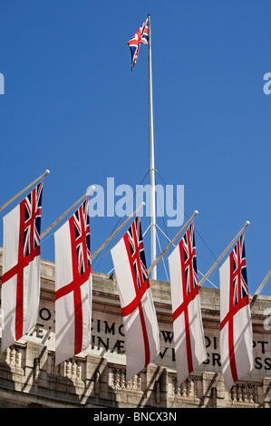 White Ensign flags of the Royal Navy on Admiralty Arch. Stock Photo