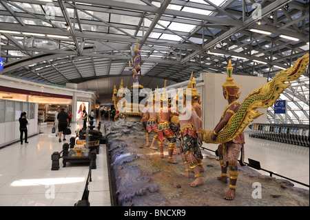 Sculpture depicting the Churning of the Milk Ocean Suvarnabhumi International airport Bangkok Thailand Stock Photo