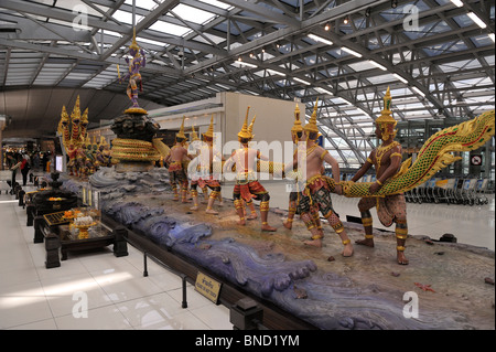 Sculpture depicting the Churning of the Milk Ocean Suvarnabhumi International airport Bangkok Thailand Stock Photo