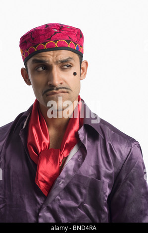 Close-up of an actor portraying a tapori and frowning Stock Photo