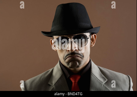 Close-up of an actor portraying a businessman sulking Stock Photo