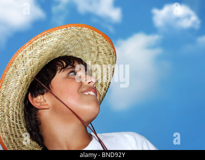 Portrait of a young beautiful boy over blue sky Stock Photo