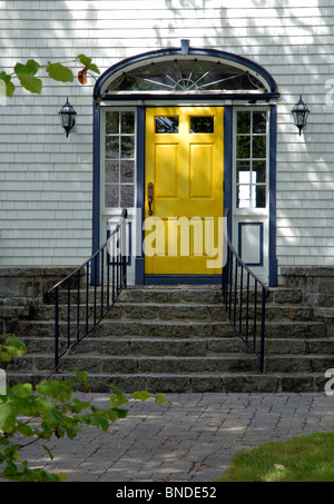 Yellow Front Door On An Old North American Traditional House Stock Photo