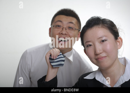 pull his tie Stock Photo