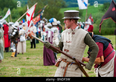 Medieval male gunner firing a handgonne on the battlefield at the Tewkesbury medieval festival 2010. Gloucestershire England Stock Photo