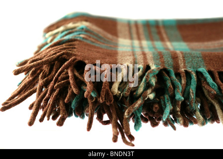 Brown-green checkered tartan wool blanket with fringe isolated on white Stock Photo