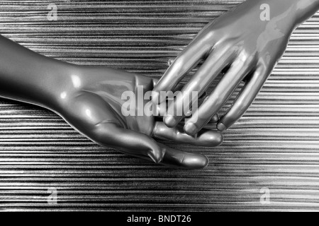 hands together futuristic robot silver steel over gray background Stock Photo