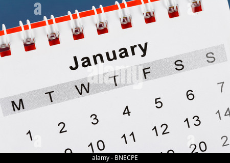 Calendar January close up with blue background Stock Photo - Alamy