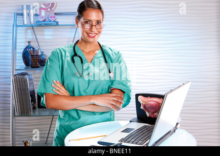 Urologist keeps records with a laptop Stock Photo