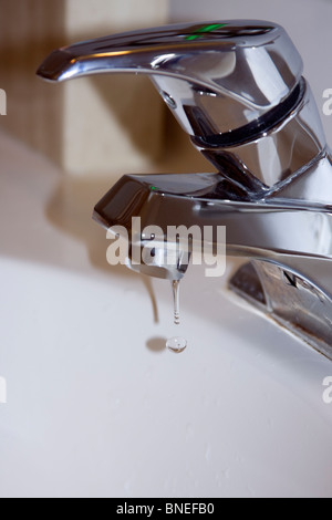 Dripping Faucet in Bathroom. Stock Photo