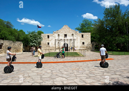 Tourists and sightseers on segways at Alamo mission, symbol of Texas independence San Antonio, Texas, USA Stock Photo