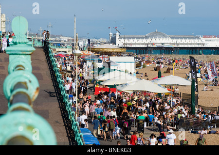 Crowded seafront and pebble beach, Brighton, East Sussex, United Kingdom Stock Photo