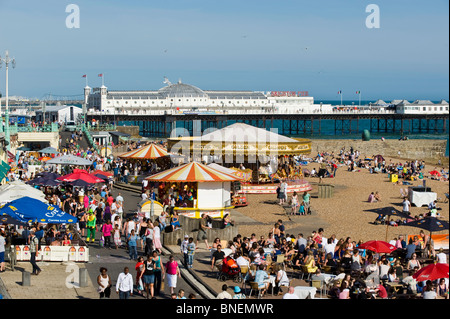 Crowded seafront and pebble beach, Brighton, East Sussex, United Kingdom Stock Photo