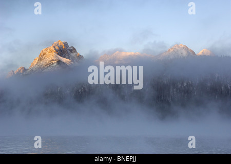 Misty dawn over Redfish Lake, Sawtooth Mountains, Rocky Mountains, Idaho, USA Stock Photo