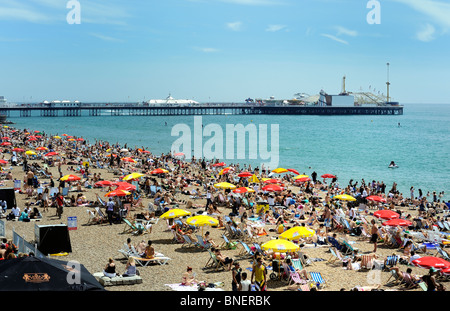 Brighton beach crowded with tourists on a hot summers day Stock Photo
