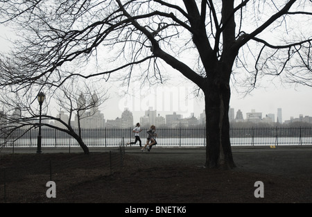 Runners on a winter day in Central Park, New York City Stock Photo