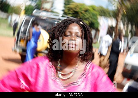 A young African lady seemingly in prayer or trance using special effects photography Stock Photo