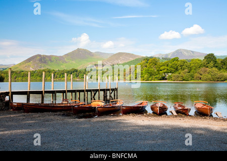 Rowing boats for hire moored along the shore of Derwent Water,at Keswick in the Lake District National Park,Cumbria,England,UK Stock Photo