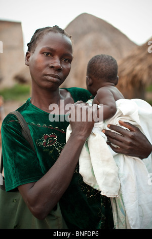 Woman and her baby in village in Amuria District, Uganda, East Africa