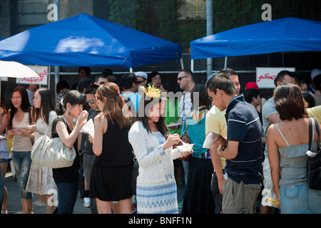 Burmese-Americans eat traditional food from vendors at the 16th annual Burmese Water Festival in New York Stock Photo