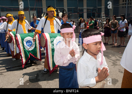 Dancers perform a procession and dance of respect to their elders at the Burmese Water Festival in New York Stock Photo