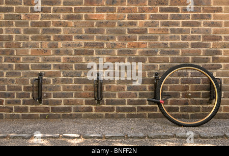 Insecure bike racks such as these at the University of Cambridge result in bicycles often being stolen minus a front wheel Stock Photo