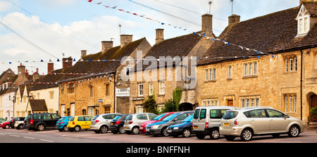 Old Cotswold stone houses along the High Street in the Wiltshire village of Sherston, England, UK Stock Photo