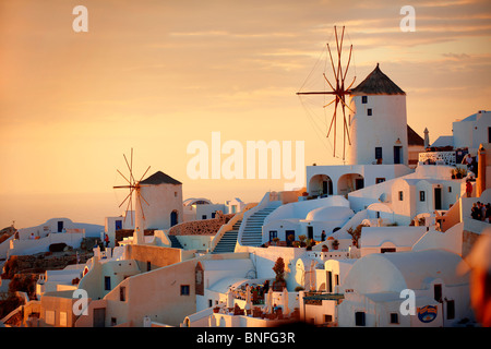 Oia ( Ia ) Santorini - Windmills and town at sunset, Greek Cyclades islands - Photos, pictures and images Stock Photo